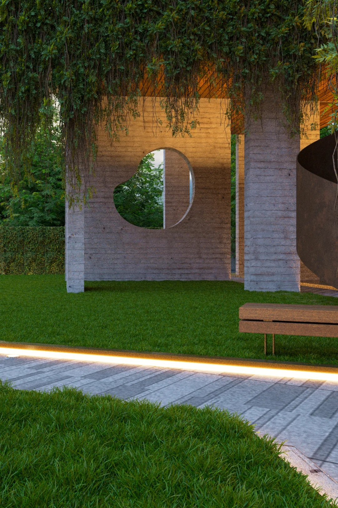 House at dusk seen across the lawn, concealed lighting picking out a garden court and a circular opening in the wall